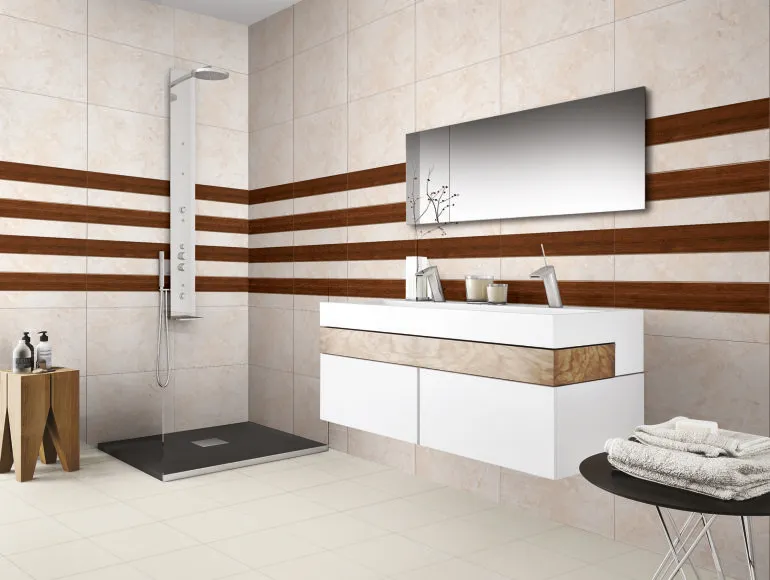 ODG Opera Crema tiles in a beige bathroom design, with a sink with mirror and shower area